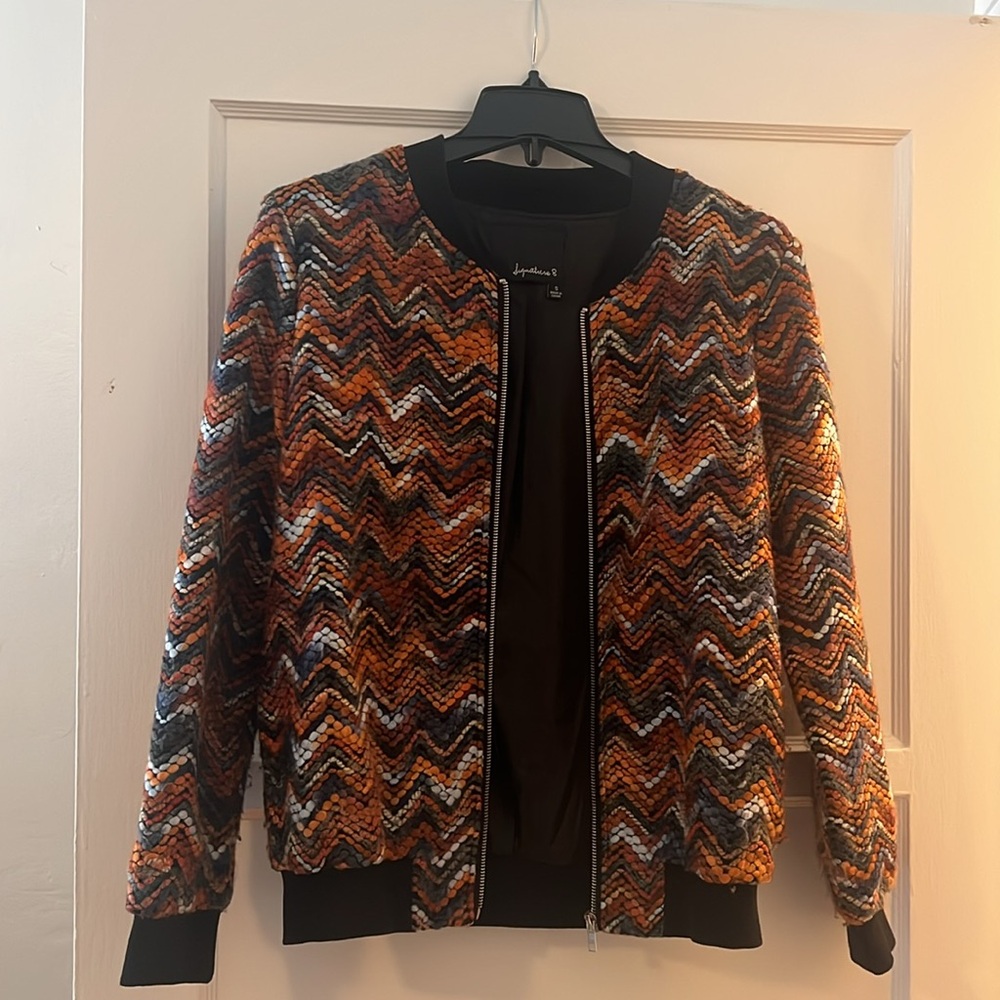 Women’s multi colored light jacket.